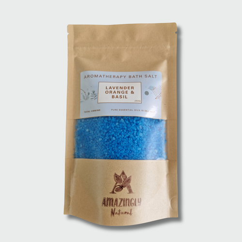 Package of Aromatherapy Bath Salt with blue contents on a light gray background